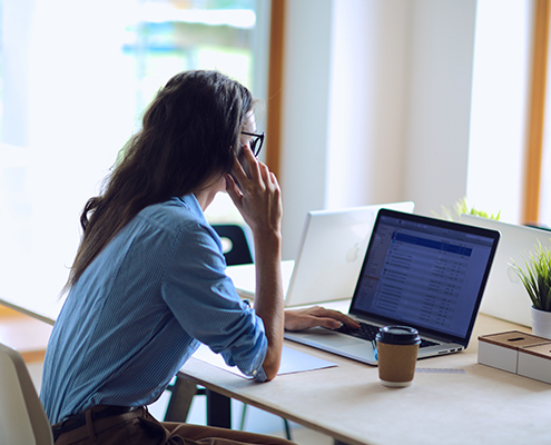 business woman sitting at office desk