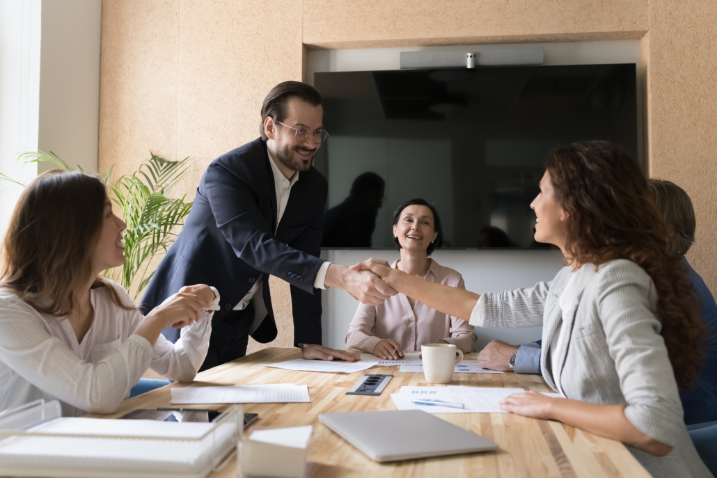 Happy Business Partners Shake Hands After Reached Agreement