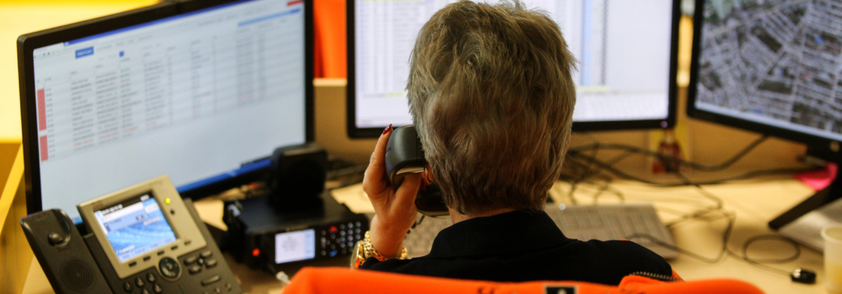 Operator sending real-time emergency alerts through integrated notification systems for safety.