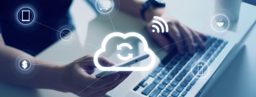Employees using a laptop and smartphone connected through cloud communication tools