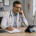 Doctor speaking with a patient using an office desk phone